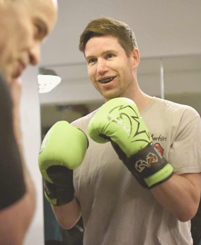 Professional member training with a boxing coach at FighterFit gym in London.